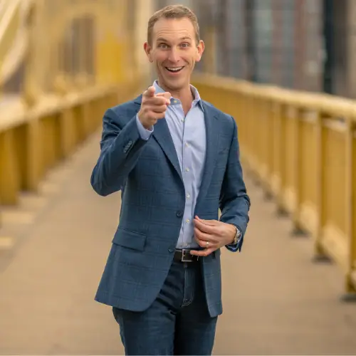 Andrew standing on a bridge in Pittsburgh