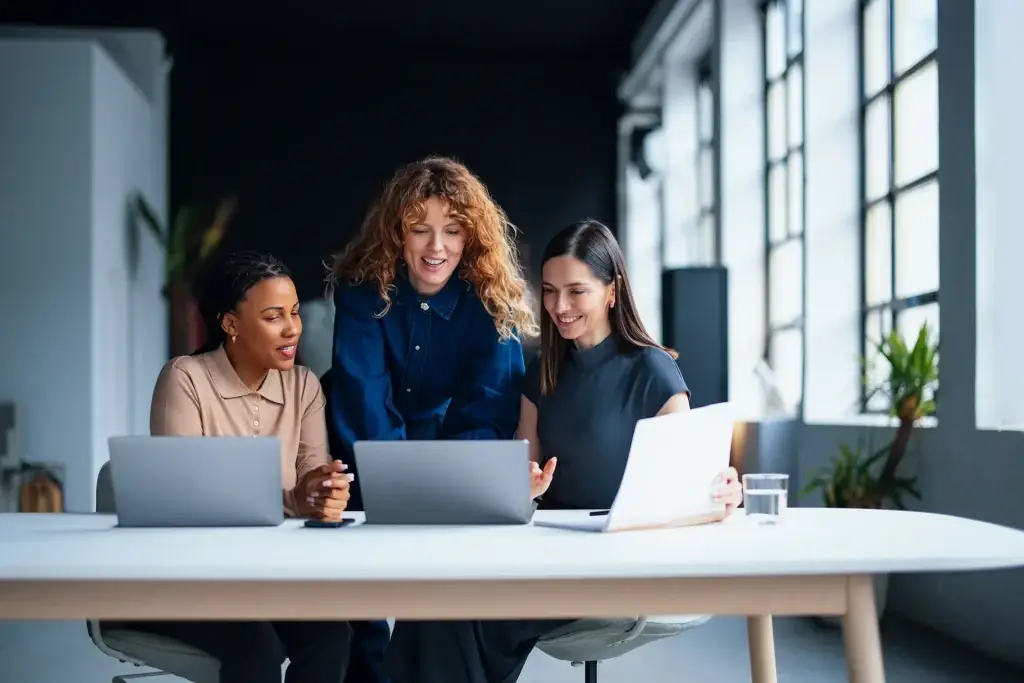 Three girls working in an office